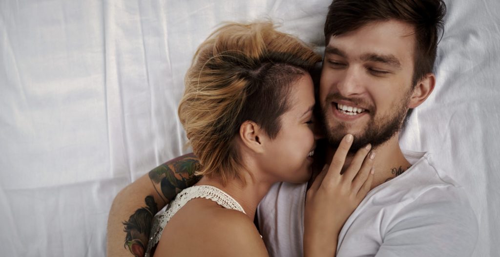 couple-tattoos-bed-happy-love