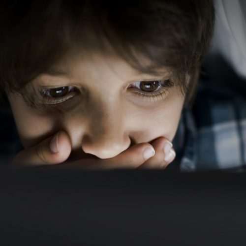 UK-age-verification-law-child-kid-secret-computer-boy-surprise-sad