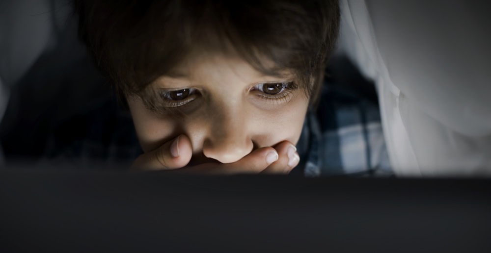 UK-age-verification-law-child-kid-secret-computer-boy-surprise-sad
