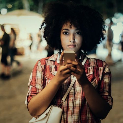 how-to-report-sex-trafficking-human-trafficking-diverse-girl-woman-phone