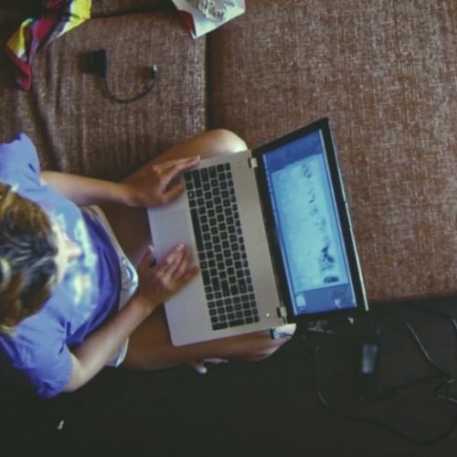 email-scams-bitcoin-bed-computer-woman-girl-laptop